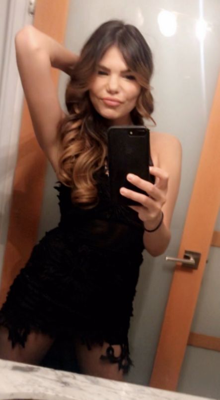 My gorgeous brunette friends taking a selfie in a black dress before a hot date in Toronto